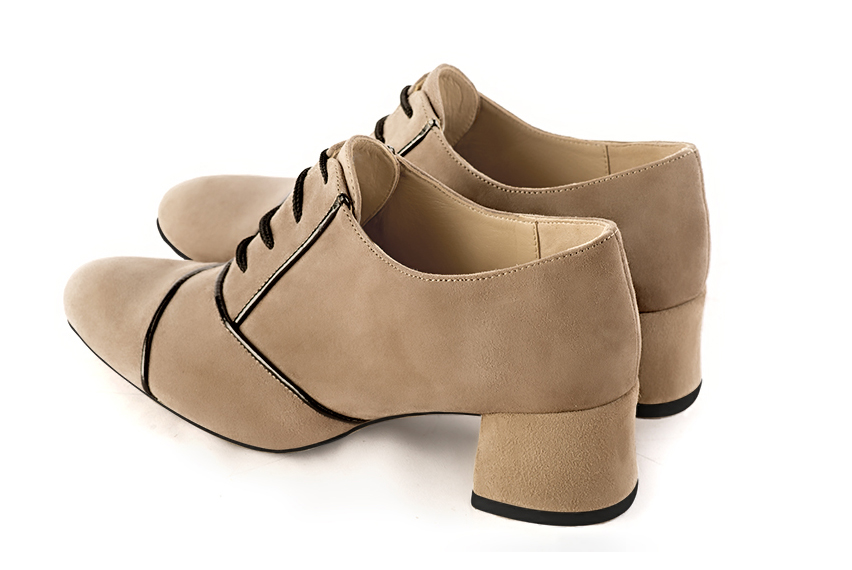 French elegance and refinement for these tan beige and gloss black essential lace-up shoes, 
                available in many subtle leather and colour combinations. This pretty flat lace-up model will enhance your most basic outfits.
To be personalised or not with your own colours and materials.  
                Matching clutches for parties, ceremonies and weddings.   
                You can customize these lace-up shoes to perfectly match your tastes or needs, and have a unique model.  
                Choice of leathers, colours, knots and heels. 
                Wide range of materials and shades carefully chosen.  
                Rich collection of flat, low, mid and high heels.  
                Small and large shoe sizes - Florence KOOIJMAN